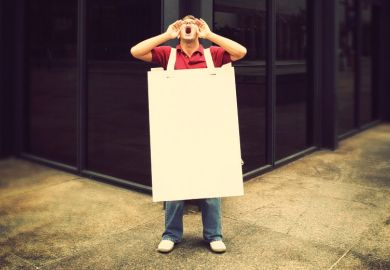 Screaming man wearing sandwich board in street Screaming man wearing sandwich board in street