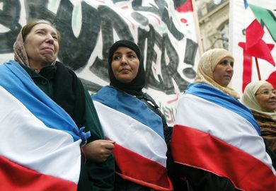 Muslim women protest against the proposal to ban headscarves in French state schools