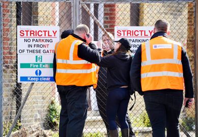 Security staff try to secure the building after squatters were evicted from the University of Brighton's former Circus Street campus.