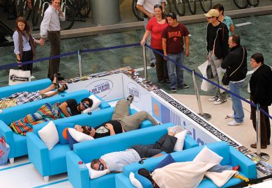 Students sleeping on sofas