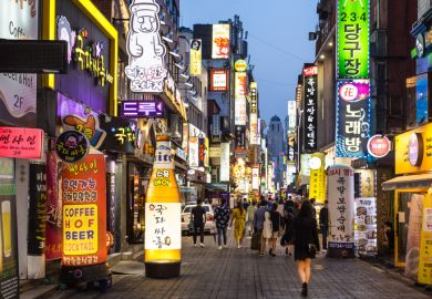 Seoul, South Korea - May 13, 2017 People wander in the busy streets of the Insadong entertainment district lined with bars and restaurants at night