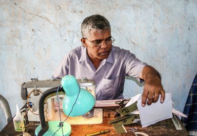 Sewing name badges for customers in Anuradhapura, Sri Lanka