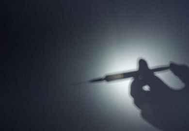 The shadow of a syringe
