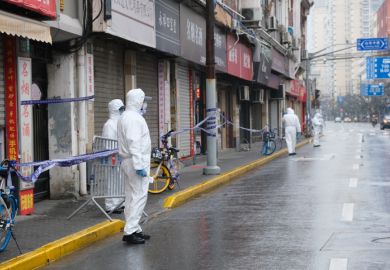 Shanghai.China-Jan.2021 new Covid-19 cases have emerged in China. Region has been locked down. Medical staff in white hazmat suit on street