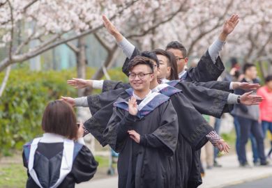Shanghai happy graduation, students taking photos in cherry festival in Tongji University.