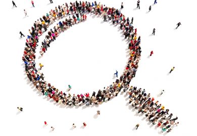 Large group of people in the shape of a magnifying glass Large group of people in the shape of a magnifying glass, symbolising shared vision