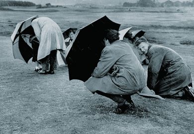 Sheltering under umbrellas