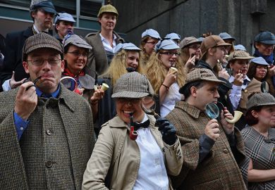 People dressed as fictional detective Sherlock Holmes gather in central London on July 19, 2014 illustrating academic detective work, plagiarism