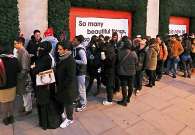 Shoppers queue outside Selfridges department store, London Shoppers queue outside Selfridges department store, London