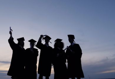 Silhouette of graduates with certificates on a sunset background