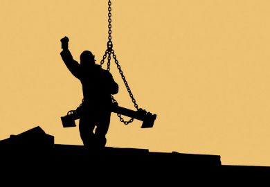 Sillhouette of construction worker handling crane load