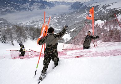 Swiss soldats remove gates at the FIS Alpine Skiing World Cup in Crans-Montana, 2016, illustrating new code of academic conduct