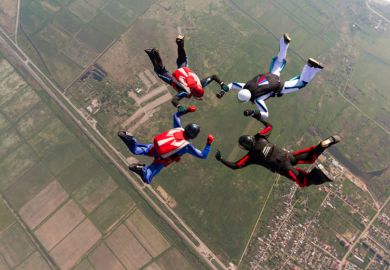 Four people skydiving 