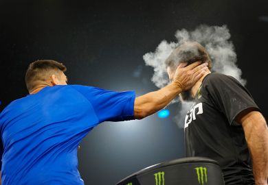 Competitors slap each other during a bout for Power Slap 2. To illustrate that scholars are calling for new “anti-SLAPP” laws to help uphold academic freedom.