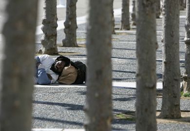 Homeless man sleeping outside
