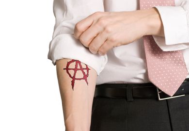 Sleeve rolled up revealing anarchist tattoo