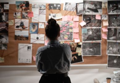 A detective studying an investigation board, symbolising data sleuthing