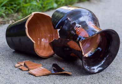 Smashed vase lying broken on path Smashed vase lying broken on path