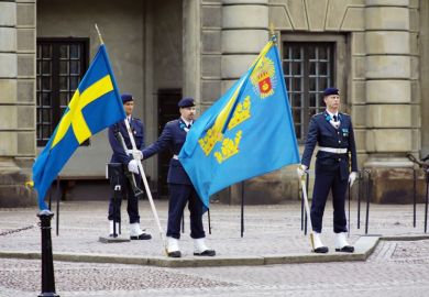 Soldiers with flags at the courtyard of the Royal Palace in Stockholm, Sweden Soldiers with flags at the courtyard of the Royal Palace in Stockholm, Sweden