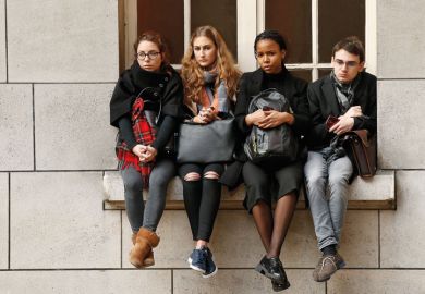 Sorbonne University students sitting on window ledge