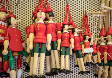 Painted wooden marionette dolls of Pinocchio in a souvenir shop in Sorrento, Italy, 2017 Sorrento, Italy - June 12, 2017 Painted wooden marionette dolls of the figure of Pinocchio in a souvenir shop in Sorrento. Italy. Pinocchio's long nose symbolised a lie.