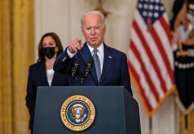 President Biden pointing President Biden pointing to illustrate Biden crackdown targets for-profit colleges