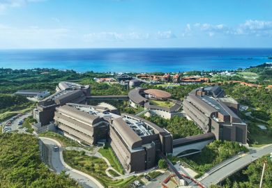 OIST campus building seen from a bird's-eye view to illustrate Funding woes cast doubt on future of pioneering Japanese campus
