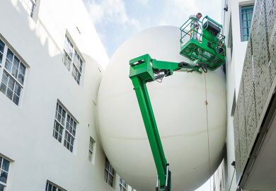 Giant balloon wedged between two buildings