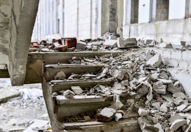A shattered staircase covered in debris A shattered staircase covered in debris