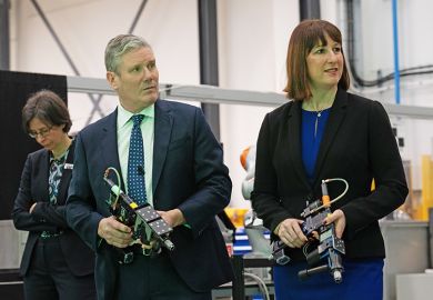 Keir Starmer (L) and Rachel Reeves, hold drills during a visit to University College London.