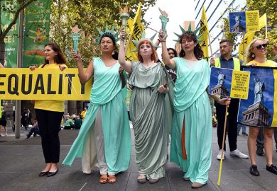 Women wearing Statue of Liberty costumes protest US President Donald Trump's immigration policies in Sydney's Martin Place on 9 March, 2017. To illustrate the affect Trump's policies against DEI practices are having on Australian research.