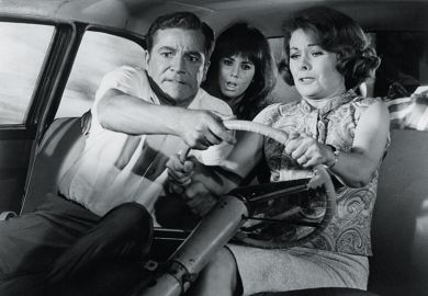 Three people try to steer car