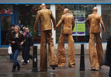 Stiltwalkers down high street