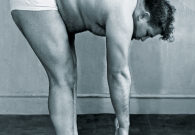 Man stretching to touch his toes