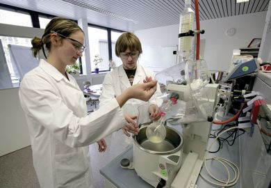 Student pharmacists at work in laboratory