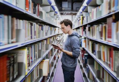 Student in university library