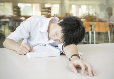 Student sleeping on desk Student sleeping on desk
