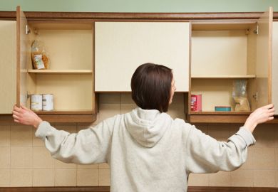 Student stands in front of empty cupboard Student food, more Australian students are going hungry due to rising costs of live