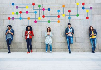 Students using social media on smartphones Students using social media on smartphones