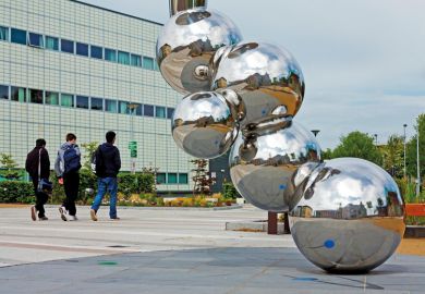 Students walking past sculpture, Loughborough University