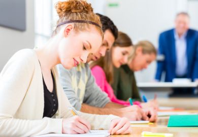 Students writing Students writing