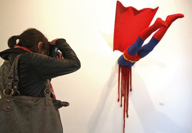 Artwork showing a superhero crashed into a wall
