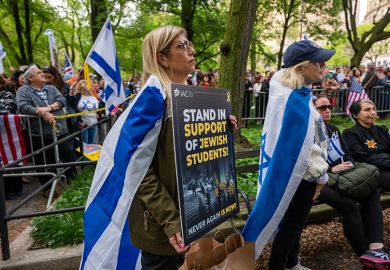 People attend a Holocaust memorial ceremony held a block away from Columbia University as protests both for and against Israel continue at area universities and colleges on 6 May, 2024 in New York City. People attend a Holocaust memorial ceremony held a block away from Columbia University as protests both for and against Israel continue at area universities and colleges on 6 May, 2024 in New York City.