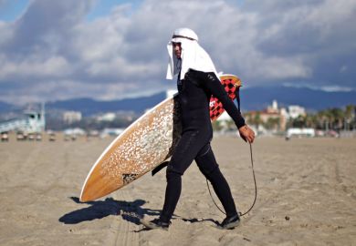 Surfer at Halloween surf contest, Santa Monica, Los Angeles, California Surfer at Halloween surf contest, Santa Monica, Los Angeles, California