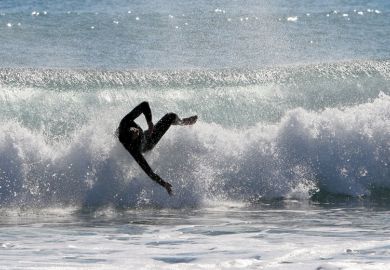 Surfer wiping out on wave, Mojácar, spain Surfer wiping out on wave, Mojácar, spain