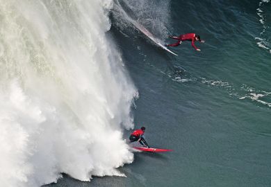 surfers compete