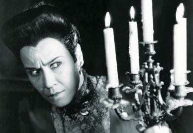 Suspicious woman holding candles