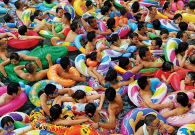 Swimmers in artificial wave pool, Suining, Sichuan province, China Swimmers in artificial wave pool, Suining, Sichuan province, China