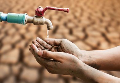 A hand under a dripping tap A hand under a tap dripping water, symbolising cuts to the UK’s ODA spending