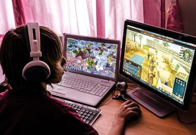 Teenager playing computer games